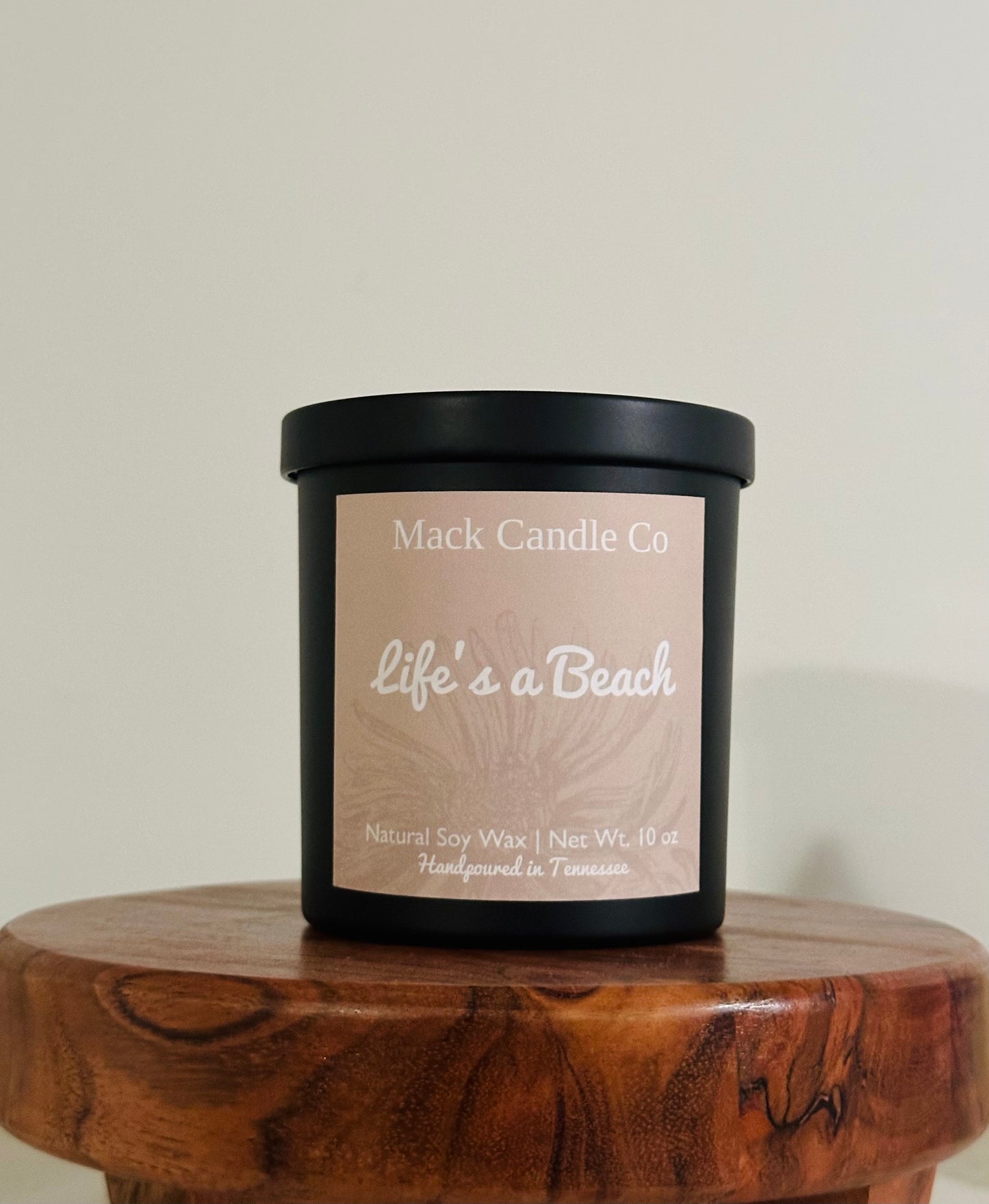 Luxury Life’s a beach Soy Candle, comes in a matte black jar filling the space of a bedroom. Non toxic clean burning handpoured in small batches in Nashville Tennessee. Smells like paradise!